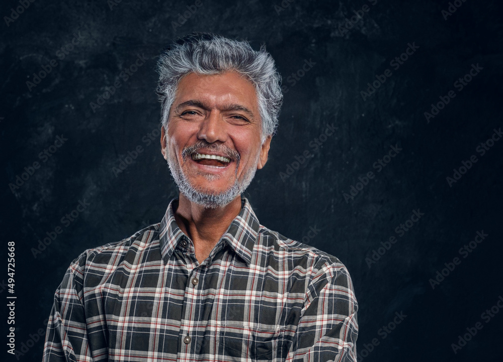 Handsome old man smiling and looking at camera Handsome old man smiling and looking at camera