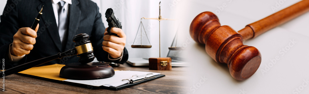 Male lawyer working with contract papers and wooden gavel on tabel in courtroom. justice and law ,attorney, court judge, concept. Male lawyer working with contract papers and wooden gavel on tabel in courtroom. justice and law ,attorney, court judge, concept.