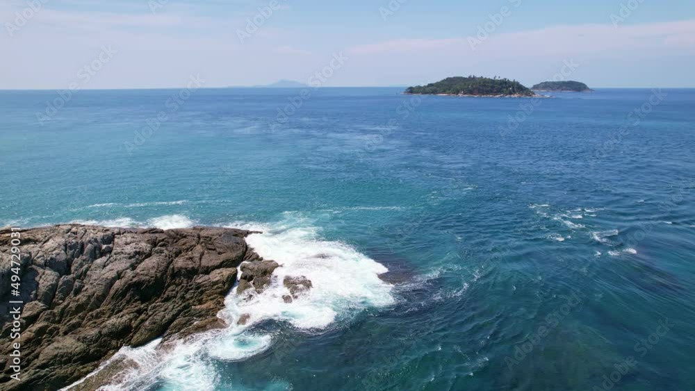Aerial view phuket seashore Wave crashing on rocks at Laem promthep cape beautiful sea in Phuket Thailand.Phuket view point is famous tourist destination at Thailand Aerial view phuket seashore Wave crashing on rocks at Laem promthep cape beautiful sea in Phuket Thailand.Phuket view point is famous tourist destination at Thailand