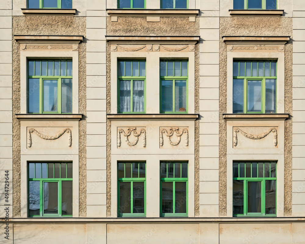 Renovated classic house facade windows pattern with green frame, Saxony, Germany
