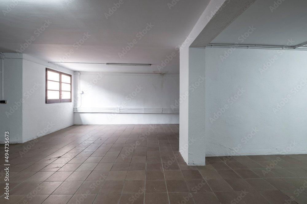 empty room of a warehouse in white color with a window empty room of a warehouse in white color with a window