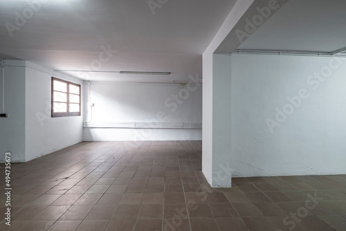 empty room of a warehouse in white color with a window