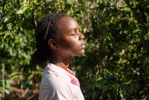 Portrait of a young African Teenage Girl in coffee bushes