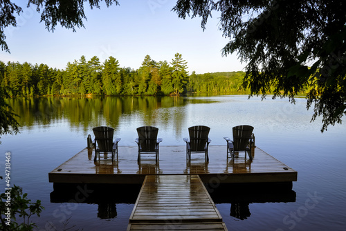 Fotografie View of  lake with chairs on the dock