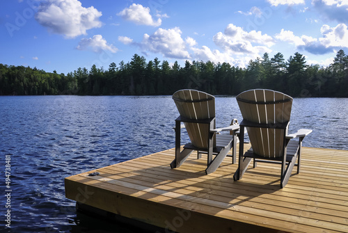 Wooden chairs on the lake