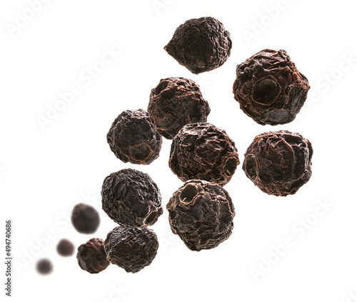 Dried hawthorn berries levitate on a white background