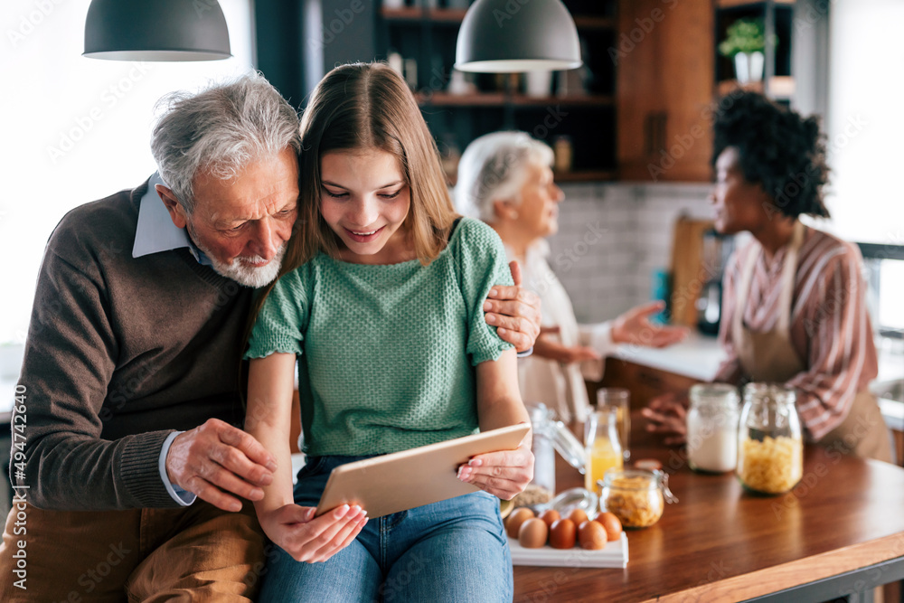 Happy multiethnic multigeneration family with husband, wife, children, grandfather and grandmother Happy multiethnic multigeneration family with husband, wife, children, grandfather and grandmother