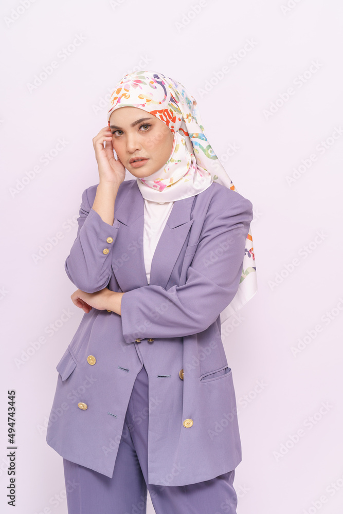 Portrait of hijab girl smiling. Pretty muslim girl. Beautiful asian muslim woman model in formal office attire posing over white background studio Portrait of hijab girl smiling. Pretty muslim girl. Beautiful asian muslim woman model in formal office attire posing over white background studio
