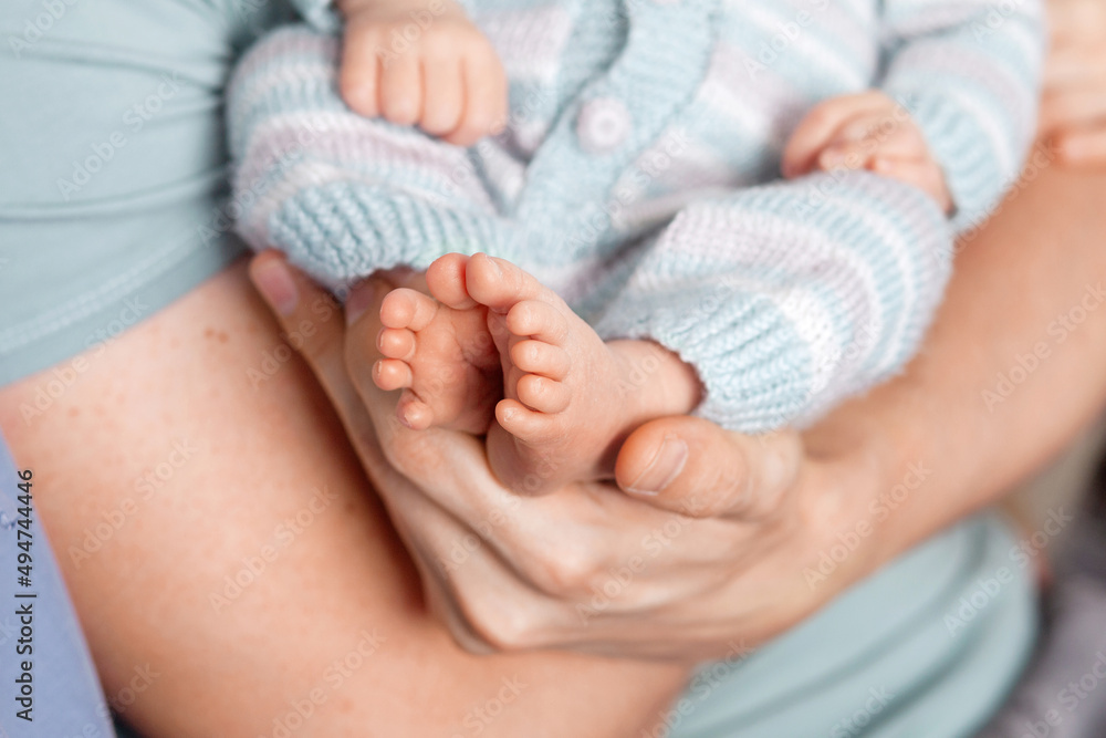 Baby feet in father hands. Tiny Newborn Baby's feet on male Shaped hands closeup. Dad and his Child. Happy Family concept. Beautiful conceptual image of Parenthood Baby feet in father hands. Tiny Newborn Baby's feet on male Shaped hands closeup. Dad and his Child. Happy Family concept. Beautiful conceptual image of Parenthood