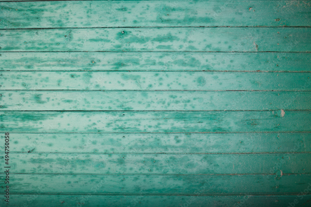 Obraz premium old blue wooden fence with peeling paint