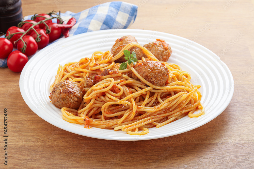 Spaghetti with meatball in tomato sause