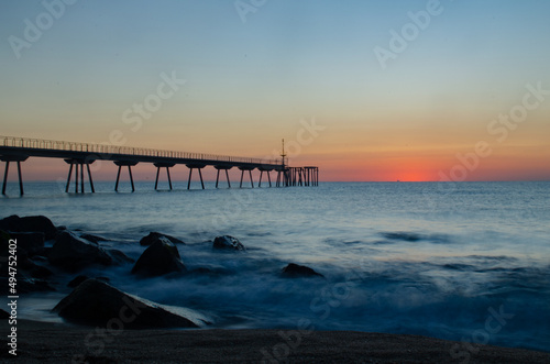 Petroleum bridge over the mediterranean sea at dawn one winter morning