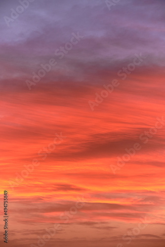 Sky light after sunset. orange background, clouds