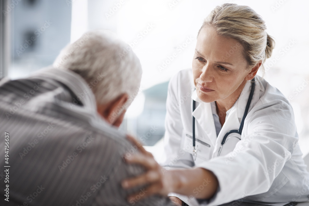 Well get through this. Cropped shot of a mature female doctor working with a senior male patient in her office in the hospital. Well get through this. Cropped shot of a mature female doctor working with a senior male patient in her office in the hospital.