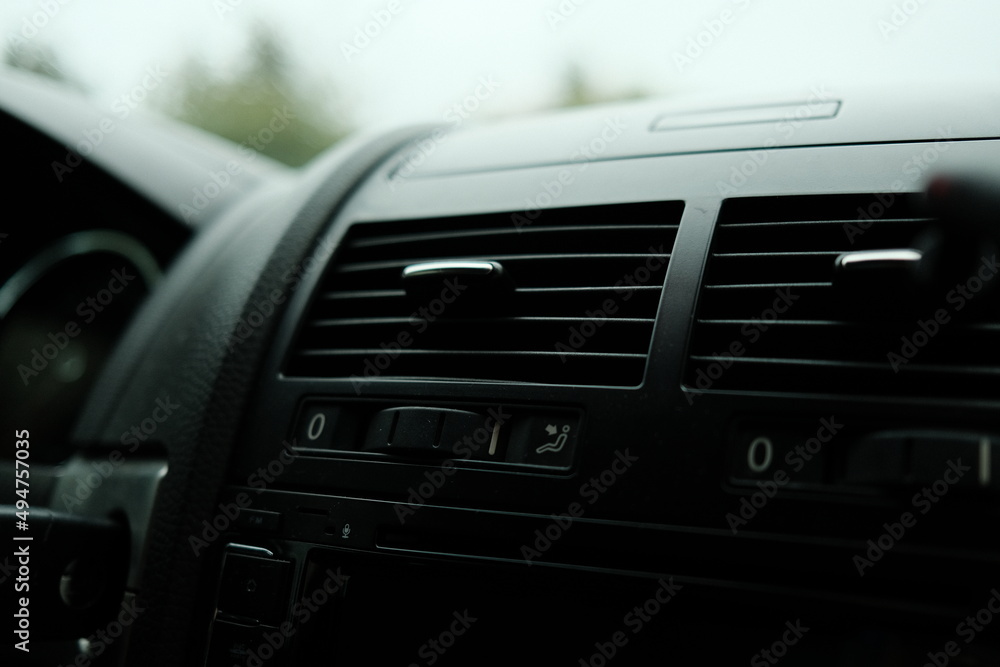 Air conditioning in the car. Control panel and ventilation. High quality photo