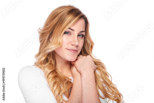 Beautiful blonde woman with curly blonde hair isolated on white background.