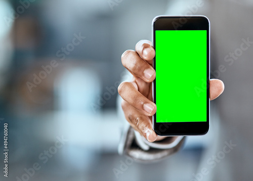 Sign up with the network that keeps you connected. Closeup shot of an unrecognizable businessman holding up a cellphone with a green screen in an office.