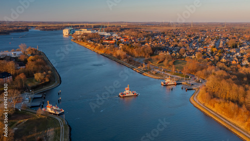 Panorama aerial view of Kiel Canal and canal ferry near Rendsburg, Schacht-Audorf ferry terminal, Schleswig-Holstein, Germany. photo