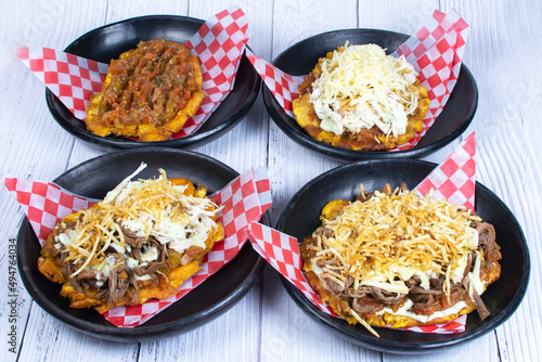 Mix of Colombian plantain patacones, traditional flavors with meat, vegetables and cheese