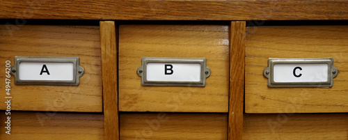 ABC letters as an inscription on a wooden archive cabinet