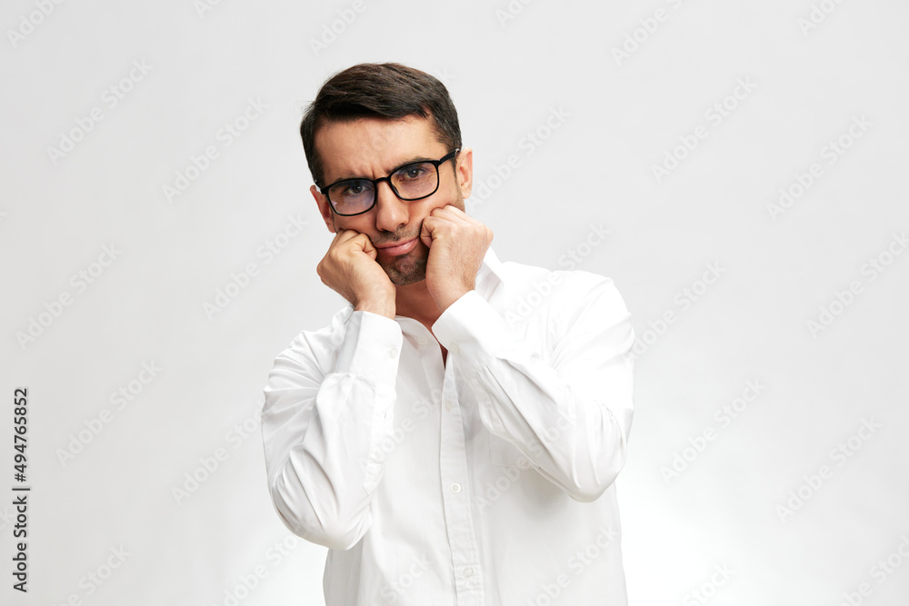 handsome businessman in a white shirt, glasses, sad expression, self-confidence light background handsome businessman in a white shirt, glasses, sad expression, self-confidence light background