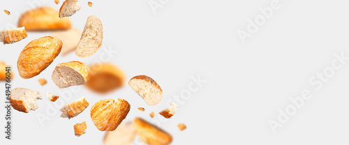 Fotografia Classic white wheat bread flying on gray background