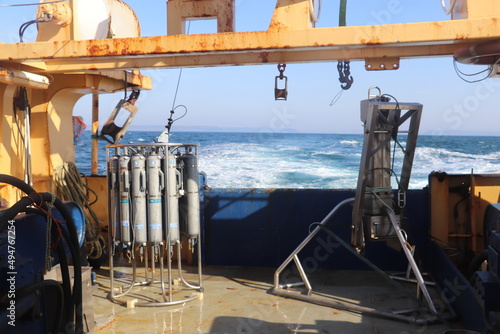 marine scientific equipment on boat with sea in background  photo