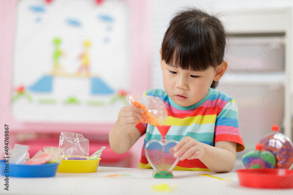 young girl making sand crafts for homeschooling young girl making sand crafts for homeschooling