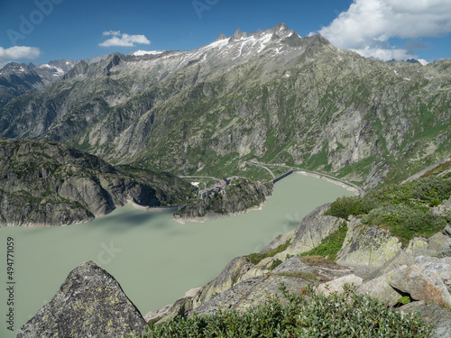 Alpine Swiss valley with big lake and sharp peaks