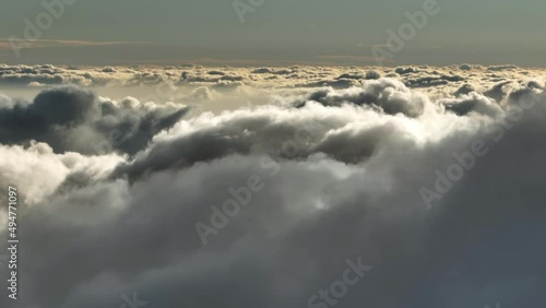 Aerial view of cumulus clouds. Sunlighten cumulus clouds under horizon. over the cumulus clouds in the morning. photo