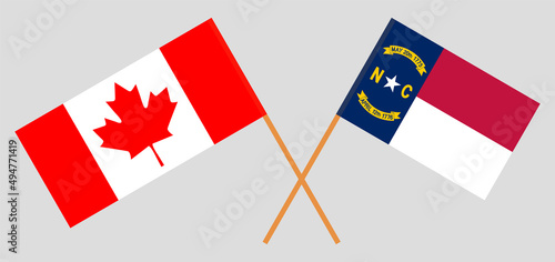 Crossed flags of Canada and The State of North Carolina. Official colors. Correct proportion