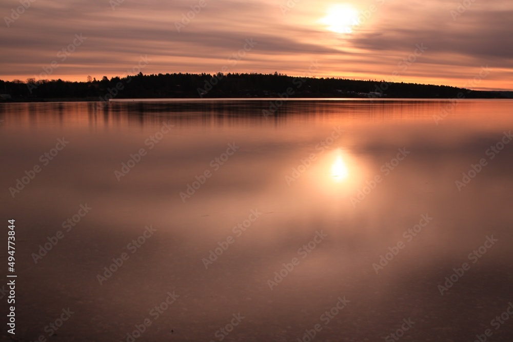 sunrise over calm water - Lysaker