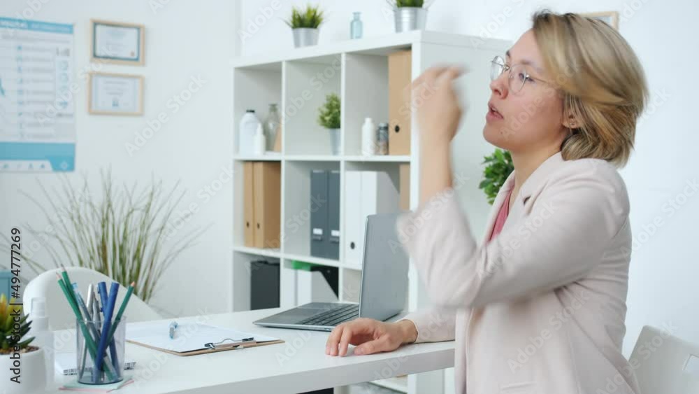 Nervour young woman patient waiting for doctor in hospital office sitting at table feeling worried. Negative emotion and healthcare concept. Nervour young woman patient waiting for doctor in hospital office sitting at table feeling worried. Negative emotion and healthcare concept.