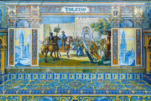 Ceramic tiles in Plaza de Espana in Seville with the theme of the province of Toledo, in Spain 