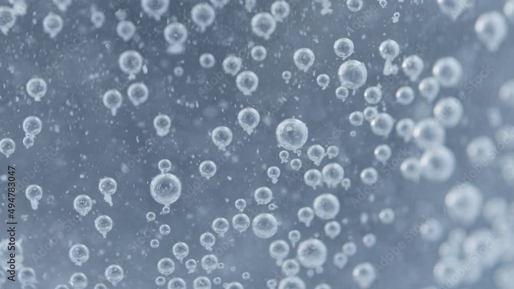 Abstract Closeup of Carbon Dioxide Bubbles Floating and Popping Inside a Transparent Glass that contains an Effervescent Tablet Pill - Fizzy Soda Drink Shot in 4K Macro and Slow Motion Abstract Closeup of Carbon Dioxide Bubbles Floating and Popping Inside a Transparent Glass that contains an Effervescent Tablet Pill - Fizzy Soda Drink Shot in 4K Macro and Slow Motion