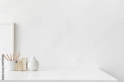 White desk with empty space. Bright stylish and minimal workspace. photo