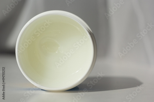 Closeup of a tub of petroleum jelly.