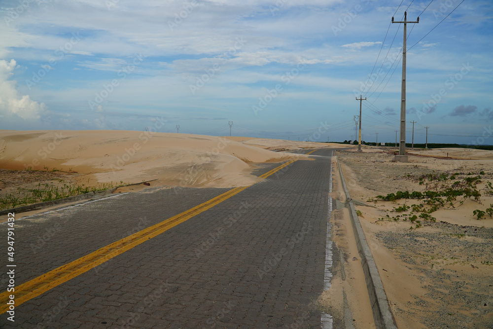 Road covered by sand dunes. Near Paulino Neves, state of Maranhão, Brazil.