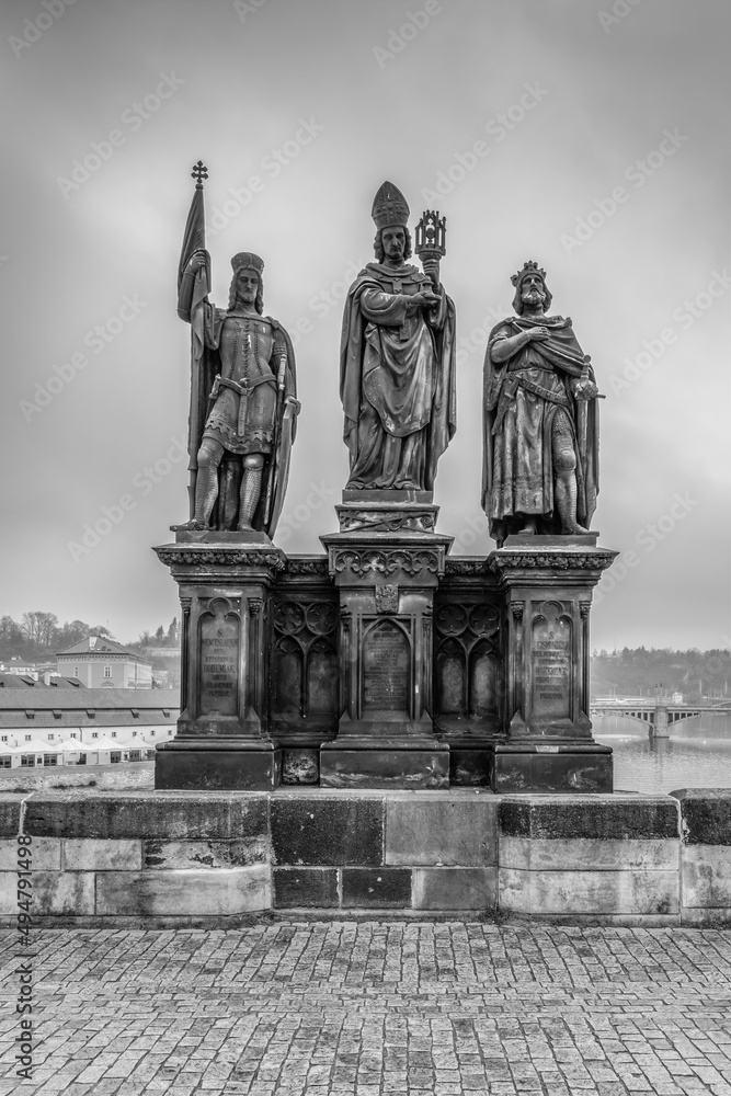 Prague the capital of the Czech Republic and the most beautiful city in Europe with beautiful statues on the Charles Bridge in black and white. Prague the capital of the Czech Republic and the most beautiful city in Europe with beautiful statues on the Charles Bridge in black and white.