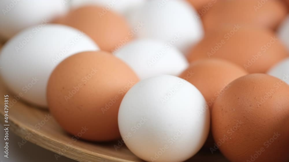 Chicken egg, rotation shot, Chicken fresh raw eggs.Healthy fresh food ingredients for breakfast. Animal products. Grocery. Chicken farm fresh eggs Chicken egg, rotation shot, Chicken fresh raw eggs.Healthy fresh food ingredients for breakfast. Animal products. Grocery. Chicken farm fresh eggs