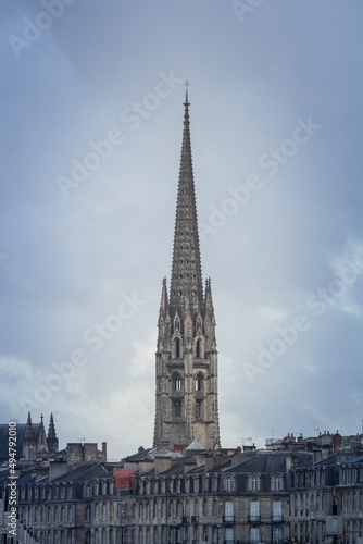 Panorama of the old town of Bordeaux, France, with the the tower of the Basilique Saint Michel basilica a cloudy afternoon in winter. it is a gothic catholic cathedral basilica... © Jerome