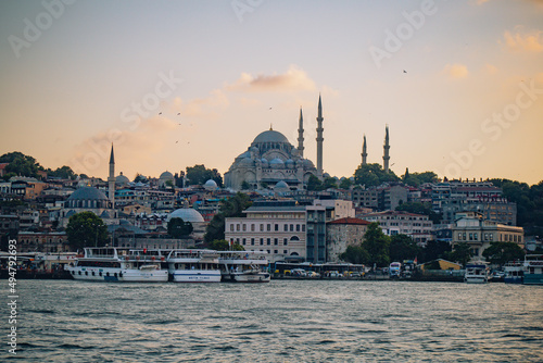 Panoramic photo taken from the river to the Blue Mosque at sunset in Istanbul Turkey
