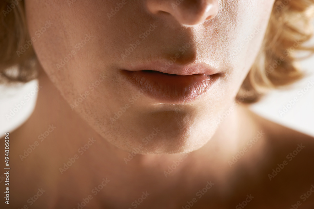 Obraz premium The male mouth. Cropped image of a young mans mouth.