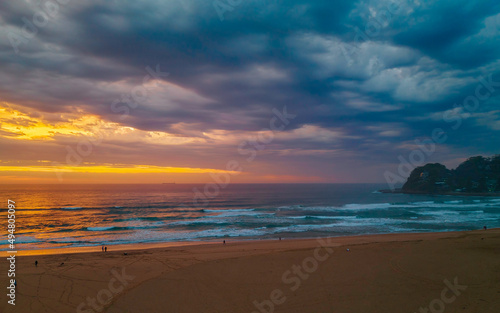 Sunrise reflections and clouds at the seaside with lagoon