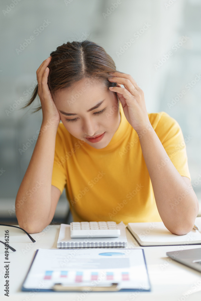 Asian business woman worry about marketing plan of this years. Finance concept. Asian business woman worry about marketing plan of this years. Finance concept.