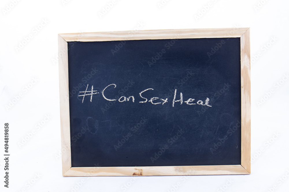 The term #CanSexHeal displayed on a blackboard The term #CanSexHeal displayed on a blackboard
