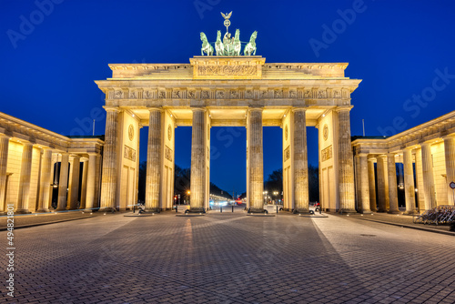 The famous illuminated Brandenburg Gate in Berlin at twilight