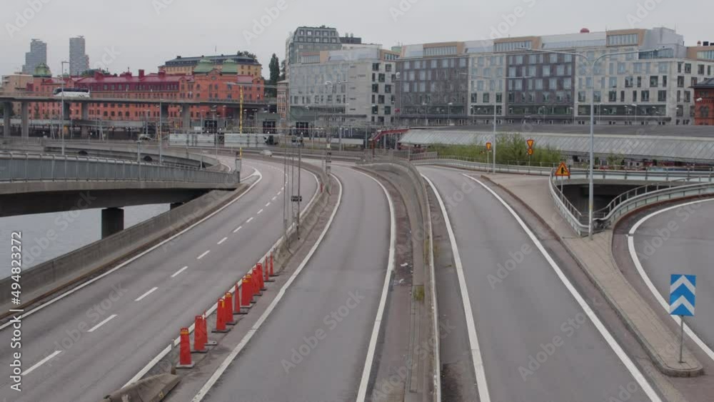 Tripod shot of empty downtown highway with Stockholm city in the background. Horizontal 4K in Slow motion. Tripod shot of empty downtown highway with Stockholm city in the background. Horizontal 4K in Slow motion.