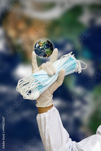 i love you hand sign with right hand holding mask with globes, Caring and protecting the world concepted, Earth photos from NASA