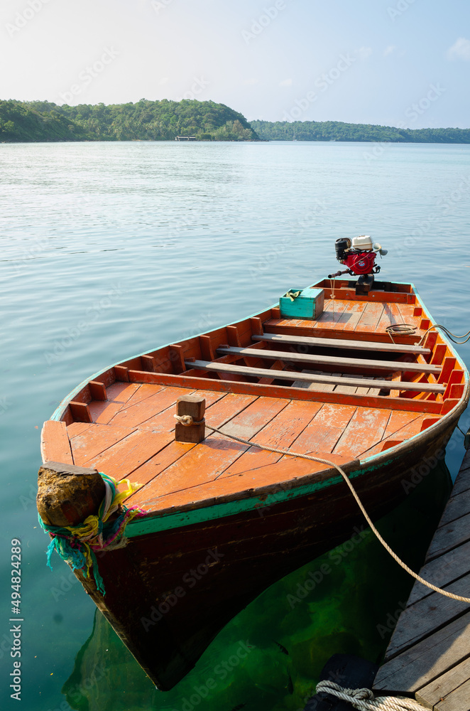 Thai traditional wooden longtail boat at pier. Koh Kood island, Thailand.